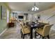 Bright dining area with a table for six and an open view to the living room at 221 Las Fuentes Dr, Kissimmee, FL 34746