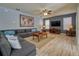 Open living room with sectional sofa and large TV at 221 Las Fuentes Dr, Kissimmee, FL 34746