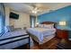 Main bedroom with king bed and extra twin bed at 221 Las Fuentes Dr, Kissimmee, FL 34746