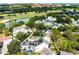 Aerial view of house with pool and solar panels, located in a neighborhood near golf course at 805 Veranda Pl, Celebration, FL 34747