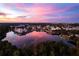 Scenic aerial view of a lakeside community at sunset at 805 Veranda Pl, Celebration, FL 34747