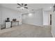 Spacious loft area with wood-look flooring and ceiling fan at 2605 Yardley St, Grand Island, FL 32735