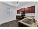 Modern kitchen with dark wood cabinets and granite countertops at 132 Vista Verdi Cir # 220, Lake Mary, FL 32746