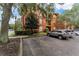 Building exterior showcasing landscaping and parking spaces at 132 Vista Verdi Cir # 220, Lake Mary, FL 32746