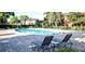 Community pool with lounge chairs and brick patio at 132 Vista Verdi Cir # 220, Lake Mary, FL 32746