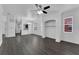 Spacious living room with hardwood floors and open kitchen view at 132 Vista Verdi Cir # 220, Lake Mary, FL 32746