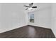 Spacious bedroom with wood-look floors and ceiling fan at 132 Vista Verdi Cir # 220, Lake Mary, FL 32746