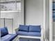 Cozy patio with blue cushioned furniture at 690 Pebble Beach Dr, Davenport, FL 33896