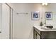 Bathroom with shower and double vanity at 690 Pebble Beach Dr, Davenport, FL 33896