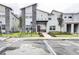 Modern two-story home with red door and landscaping at 690 Pebble Beach Dr, Davenport, FL 33896