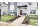 Modern home exterior with red door at 690 Pebble Beach Dr, Davenport, FL 33896
