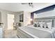 Primary bedroom with king-size bed and access to a bathroom at 690 Pebble Beach Dr, Davenport, FL 33896