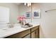 Double vanity bathroom with modern finishes at 690 Pebble Beach Dr, Davenport, FL 33896