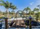 Charming pond with footbridge and butterfly sculpture at 1242 Normandy Dr, Haines City, FL 33844