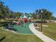 Modern playground with swings and play structures at 1242 Normandy Dr, Haines City, FL 33844
