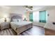 Spacious Primary bedroom with a king-size bed and plenty of light at 17833 Woodcrest Way, Clermont, FL 34714