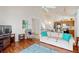 Living room with comfortable sofa and hardwood floors at 17833 Woodcrest Way, Clermont, FL 34714