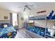 Bedroom with bunk beds and a twin bed, perfect for  at 17833 Woodcrest Way, Clermont, FL 34714