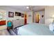 Main bedroom with a large bed and ensuite bathroom access at 17833 Woodcrest Way, Clermont, FL 34714