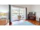 Living room with sliding glass doors that open to a pool view at 17833 Woodcrest Way, Clermont, FL 34714