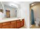 Bathroom with a single sink vanity and bathtub at 17833 Woodcrest Way, Clermont, FL 34714