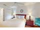 Cozy bedroom with a double bed, hardwood floors, and nightstands at 17833 Woodcrest Way, Clermont, FL 34714