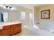 Bathroom boasts a double vanity, soaking tub, and shower at 17833 Woodcrest Way, Clermont, FL 34714