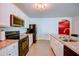 Modern kitchen with black appliances and white cabinets at 3690 Maidencain St, Clermont, FL 34714