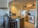 Efficient kitchen with granite countertops and breakfast bar at 4010 San Gallo Dr # 103, Kissimmee, FL 34741