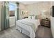 Charming bedroom with a double bed and decorative wall at 9179 Breeze Mist Ter, Kissimmee, FL 34747
