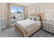 Cozy bedroom with a queen-size bed and window seat at 9179 Breeze Mist Ter, Kissimmee, FL 34747