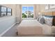 Spacious bedroom with large window and neutral decor at 9179 Breeze Mist Ter, Kissimmee, FL 34747