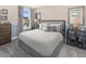 Serene bedroom with a king-size bed and window view at 9179 Breeze Mist Ter, Kissimmee, FL 34747