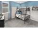 Bedroom with built-in bunk beds and blue accent wall at 9179 Breeze Mist Ter, Kissimmee, FL 34747