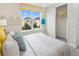 Well-lit bedroom with a comfortable bed and closet at 9179 Breeze Mist Ter, Kissimmee, FL 34747