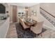 Formal dining room featuring a large wood table and neutral decor at 9179 Breeze Mist Ter, Kissimmee, FL 34747