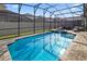 Relaxing screened-in pool and spa at 9179 Breeze Mist Ter, Kissimmee, FL 34747