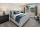 Bright bedroom featuring a comfortable bed and ample natural light at 9179 Breeze Mist Ter, Kissimmee, FL 34747