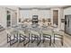 Spacious kitchen with granite island, stainless steel appliances, and white cabinetry at 9179 Breeze Mist Ter, Kissimmee, FL 34747