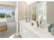 Double vanity bathroom with modern fixtures at 9179 Breeze Mist Ter, Kissimmee, FL 34747