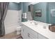 Clean bathroom with white vanity and bathtub at 9179 Breeze Mist Ter, Kissimmee, FL 34747