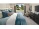 Spacious bedroom with large window and plush bedding at 9179 Breeze Mist Ter, Kissimmee, FL 34747