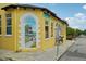 Yellow building with a lighthouse mural and electric bike shop at 12783 Trovita Dr, Grand Island, FL 32735