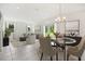 Open concept dining area with view to backyard at 12783 Trovita Dr, Grand Island, FL 32735