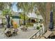 Relaxing patio with a fountain and cafe seating at 12783 Trovita Dr, Grand Island, FL 32735