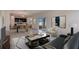 Open living room with ample natural light and stylish furniture at 12783 Trovita Dr, Grand Island, FL 32735