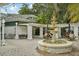 Outdoor patio area with fountain and seating at 12783 Trovita Dr, Grand Island, FL 32735