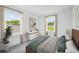 Bright bedroom with large windows and plush bedding at 12783 Trovita Dr, Grand Island, FL 32735