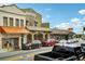 Several shops and restaurants line the street, showcasing a vibrant business district at 12783 Trovita Dr, Grand Island, FL 32735