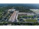 Aerial view of new homes and community with roads and lush landscape at 2564 Hawks Overlook Pl, Oviedo, FL 32765